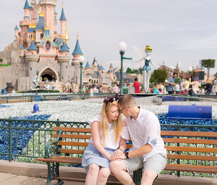 Couple embracing on a bench at Disneyland Paris