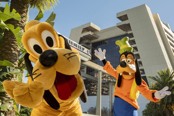 Pluto and Goofy welcoming guests to Disney's Contemporary Resort
