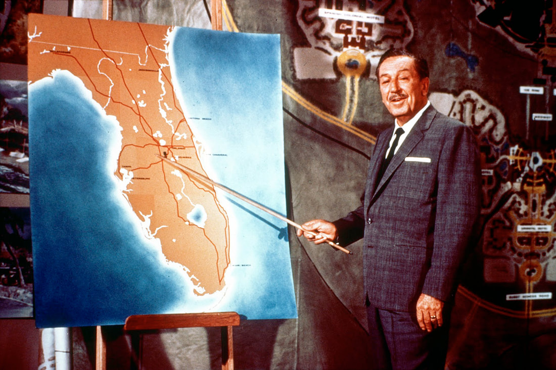 Walt Disney with a map of the Florida Project
